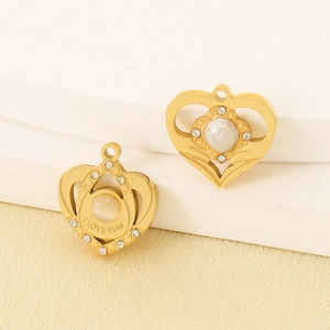 Detail of heart pendants with pearls and zircons, including an I LOVE YOU engraved charm