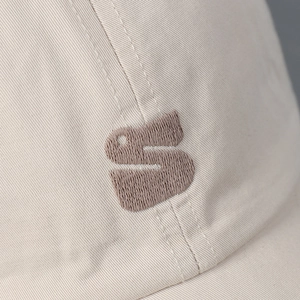 Beige cotton baseball cap featuring high-quality 3D brown letter S embroidery