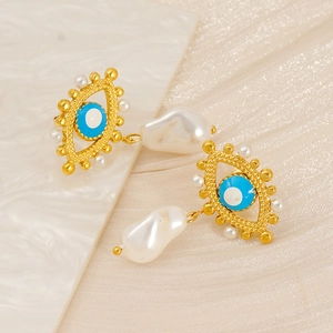 Evil eye earrings in gold with blue enamel and irregular white baroque pearls