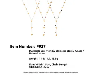 Detailed view of three gold Y-shaped heart necklaces with natural agate and long tassels
