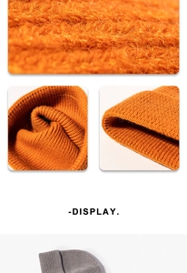 Detailed knit texture of the ribbed cuff on yellow and grey winter beanies