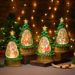 Detailed view of LED lighted Christmas tree water snow globes with Santa and snowman motifs
