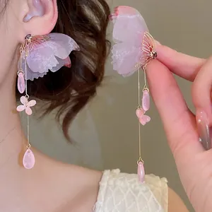Pink butterfly tassel drop earrings with zircon floral accents for a romantic look