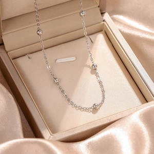 Elegant silver titanium steel beaded necklace displayed in a luxury jewelry gift box