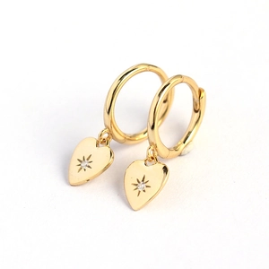 Gold heart drop earrings with starburst engraving and small diamond center