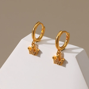 Detail of 18K gold plated crown drop earrings with pavé zircon stones on white display