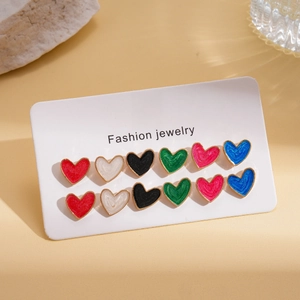 Detail of 12-piece colorful enamel heart stud earrings displayed on fashion jewelry card