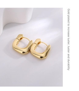 Detail view of gold-plated U-shaped earrings with S925 sterling silver certification mark