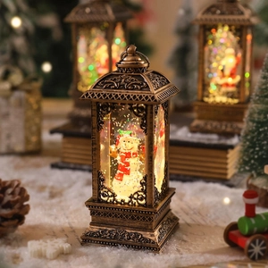 Detail of vintage Christmas lantern featuring a snowman inside with swirling glitter