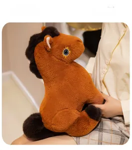 Detail of soft plush horse with intricate sunflower eye embroidery and fluffy mane