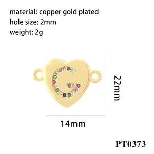 Detail view of 18K gold plated copper heart pendant with colorful zircon letter G