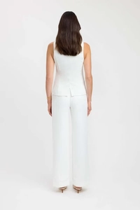 Rear view of white sleeveless top with back slit and wide leg trousers set for women