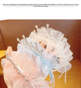 Detail of pink lace headband with rhinestone crown and pearl tassels for girls