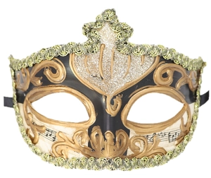 Detail of Venetian masquerade mask with gold glitter relief and musical note pattern