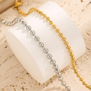 Polished 18K gold and silver titanium steel ball chain bracelet with lobster clasp