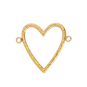 Macro detail of golden heart connector with textured surface and dual rings