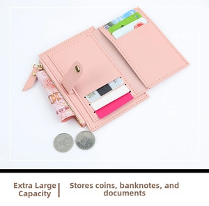 Detailed view of pink tri-fold wallet with multiple card slots and zipper pocket