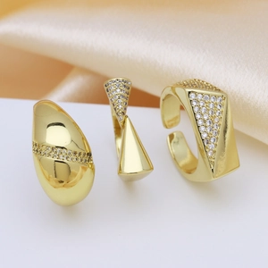 Minimalist gold-plated copper rings set with cubic zirconia in various geometric styles