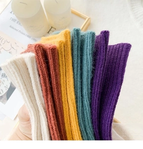 Close-up of thick ribbed knit socks in assorted warm colors for winter comfort