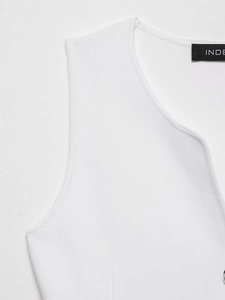 Detailed macro view showing the high-quality knit texture and collar stitching of white vest