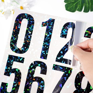 Detail of reflective laser vinyl numbers stickers showing holographic texture and adhesive back
