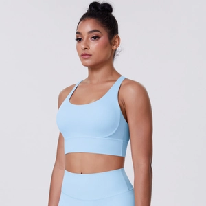 Light blue seamless sports bra with wide supportive underband and matching yoga leggings