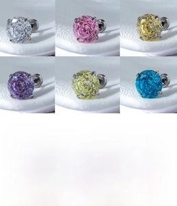 Macro view of multi-colored zircon earrings in 6mm and 8mm sizes with four-prong setting