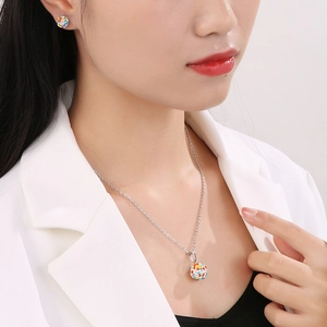 Detail of model wearing a sparkling colorful crystal ball necklace and stud earrings set