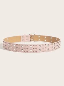 Detail of pink faux leather belt with silver metal rivets and double row grommet design