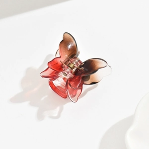 Close-up of 3.5cm butterfly hair clip with red to brown gradient transparent finish