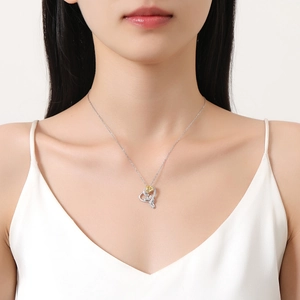 S925 silver heart necklace with golden rose and diamonds on a model in white dress