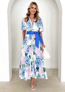 Detail of bohemian floral print dress with puff sleeves and blue waist belt