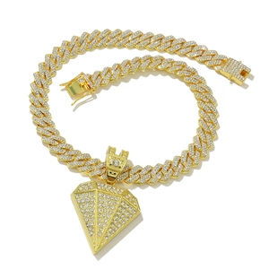 Gold cuban link chain with iced-out pyramid pendant and sparkling crystal pavé setting