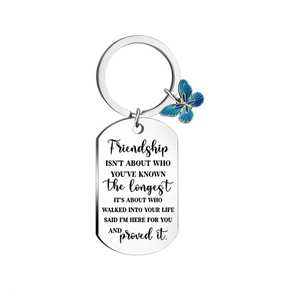 Silver stainless steel butterfly keychain with engraved friendship message on white background