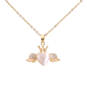 Gold angel heart necklace with crown detail and opalescent stone on white backdrop