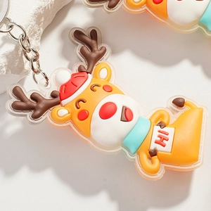 Macro detail of a 3D cartoon reindeer Christmas keychain with soft rubber texture