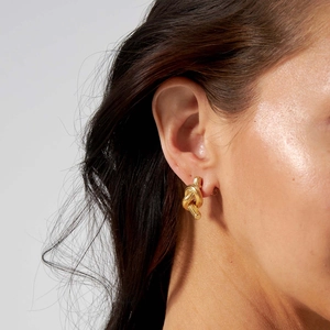 Elegant 14k gold plated stainless steel knot earrings for women with high metal luster