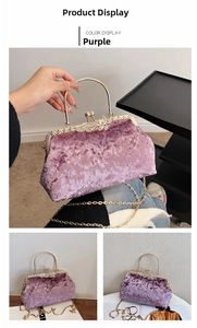 Detail of purple velvet evening bag with gold handle and sparkling diamond butterfly clasp