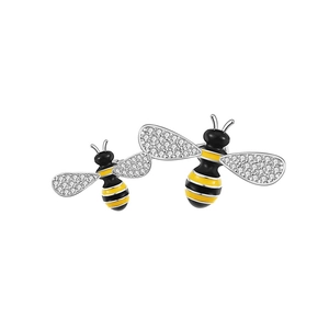 Detail of bee brooch with yellow black enamel wings and sparkling zircon crystals