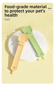 Detail of food-grade plastic cat treat squeeze spoon in yellow and green colors