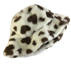 Winter plush cow print bucket hat featuring soft faux fur and brown spots on white