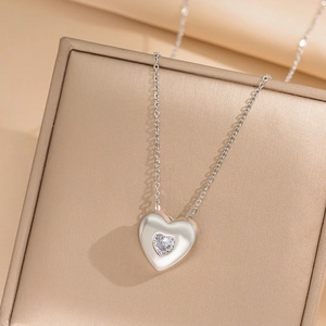 Titanium steel heart pendant necklace with zircon stone on elegant gold jewelry gift box