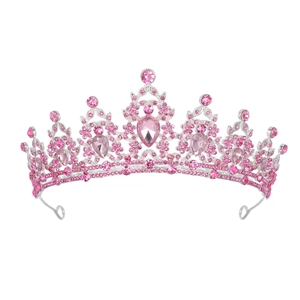 Detailed macro view of pear-shaped pink crystal centerpiece on a silver bridal crown