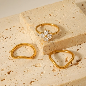 Three-piece golden stainless steel ring set with zircon clover and wave bands