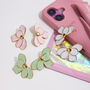 Floral stainless steel earrings in pink, white, and green enamel finish on white background