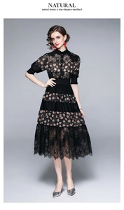 Detailed view of elegant black lace dress featuring vintage polka dot layered skirt