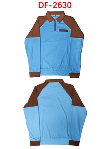 Detailed view of waffle knit texture and corduroy contrast on a men's half-zip polo shirt