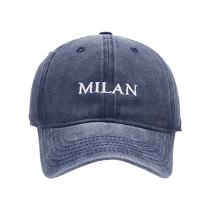 Navy blue washed denim baseball cap featuring white MILAN letter embroidery on front