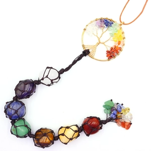 Detail of handmade Tree of Life car hanging with seven chakra natural crystal stones