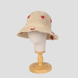 Foldable straw sun hat for women with red heart crochet patterns and a wide brim style